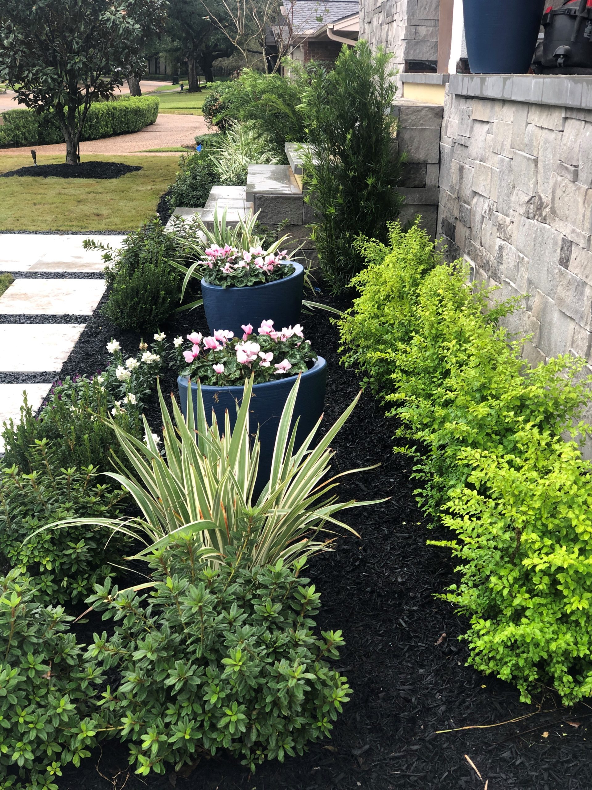 modern landscaping with crushed granite and concrete tile patio