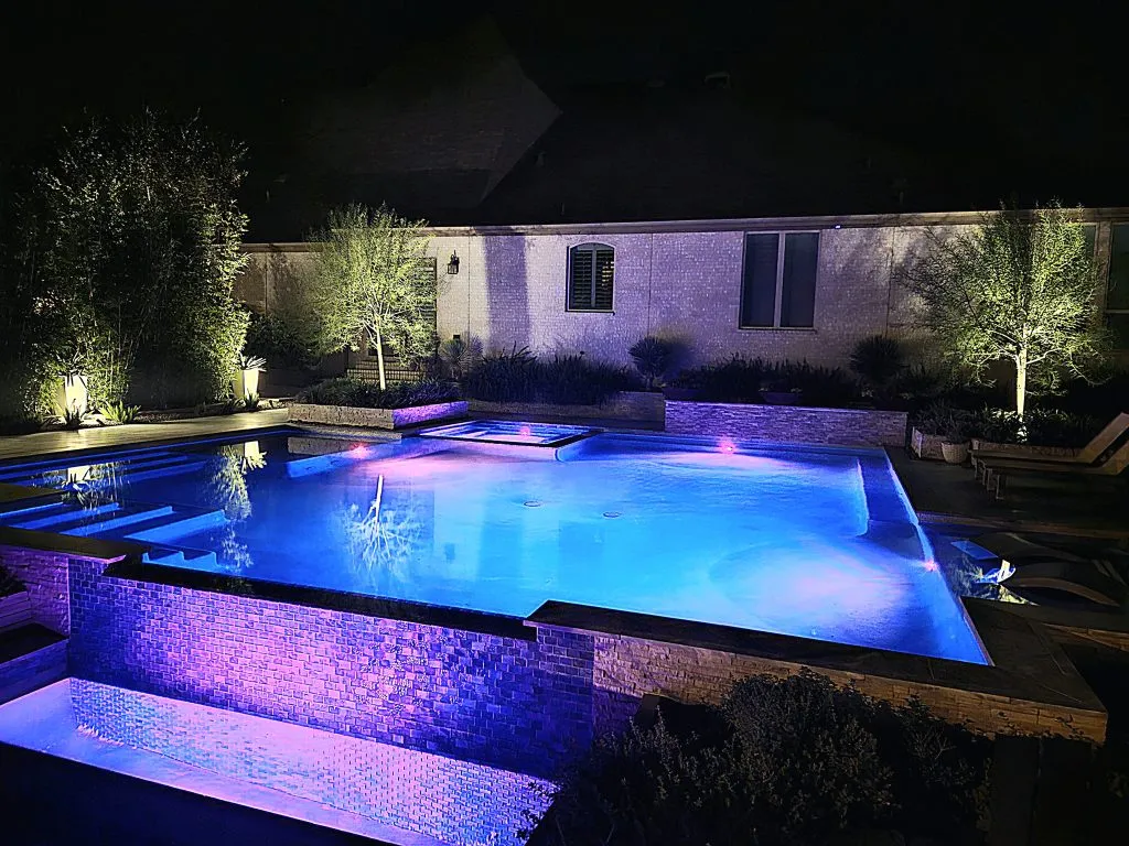 luxury pool with lighting nigh fulshear tx
